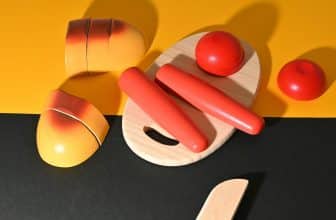 a wooden toy with a red and yellow design on it